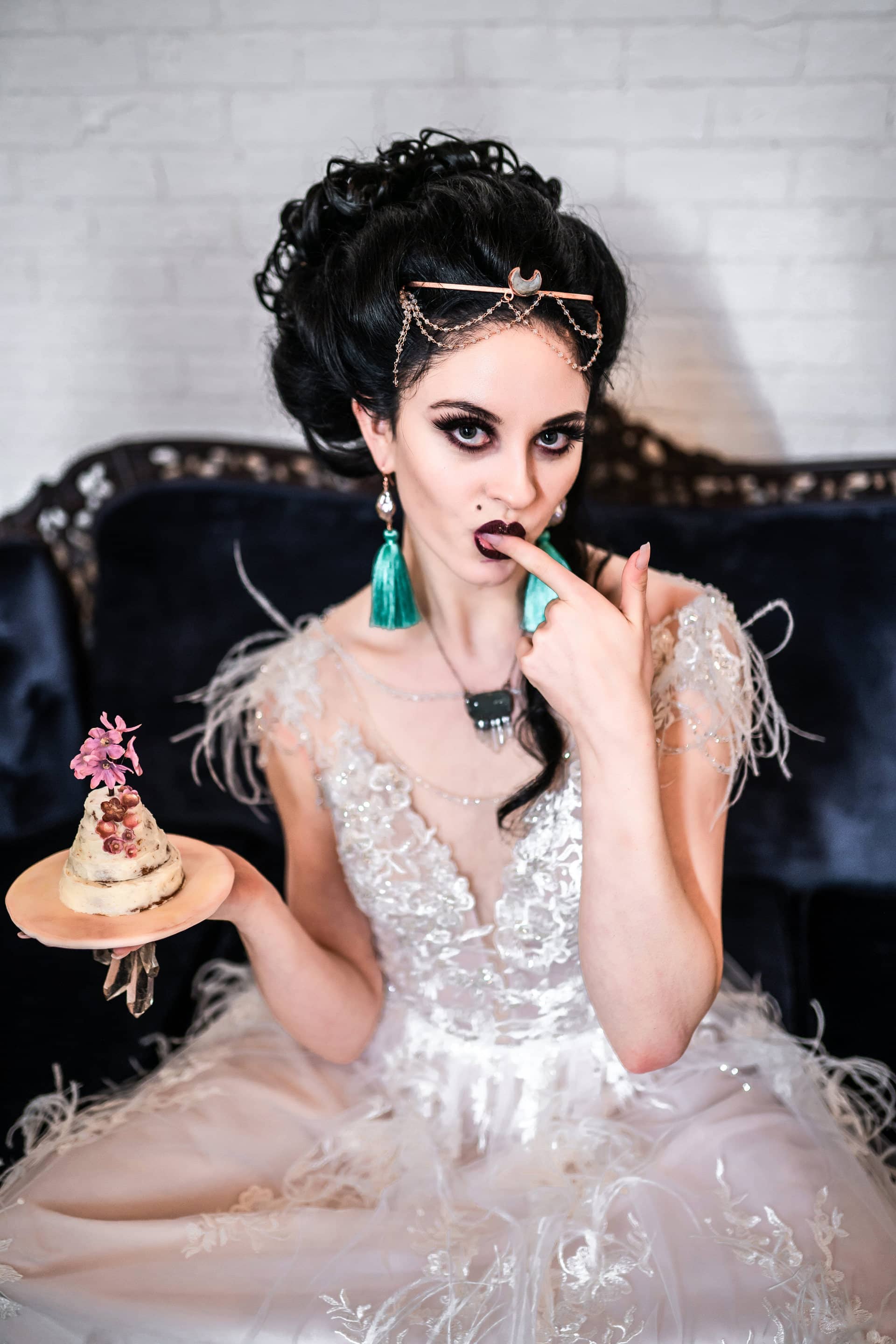 Model eating cake wearing Desert Daisy Jewelry from the Marie Collection